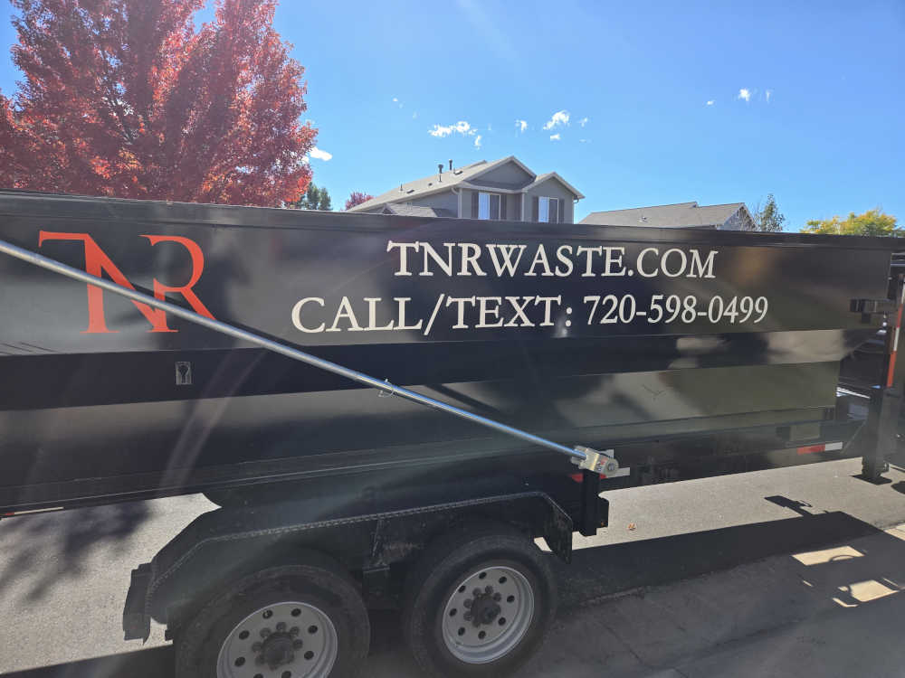 TNR Waste crew on a residential job site